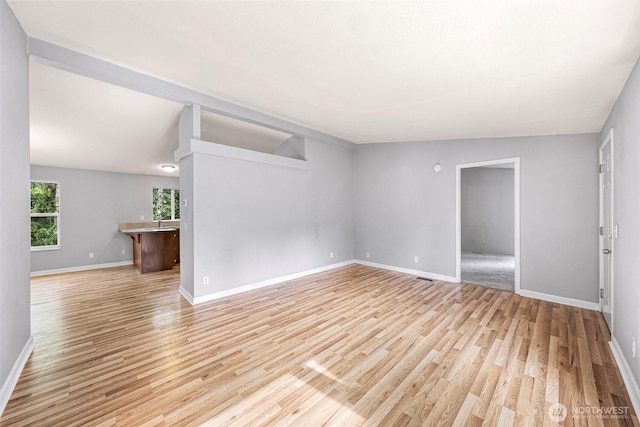 4949 Samish Way Unit 17, Bellingham, WA 98229 - empty room with baseboards, light wood finished floors, and a sink