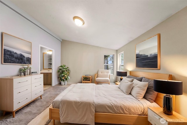 4949 Samish Way Unit 17, Bellingham, WA 98229 - bedroom with lofted ceiling, light wood-style flooring, and ensuite bath