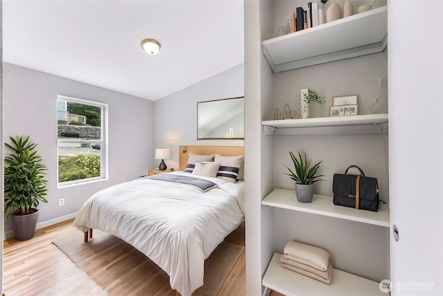 4949 Samish Way Unit 17, Bellingham, WA 98229 - bedroom featuring wood finished floors, baseboards, and lofted ceiling