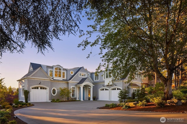 1848 77th Ave NE, Medina, WA 98039 - shingle-style home with driveway and an attached garage