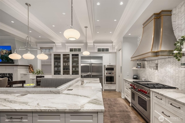 1848 77th Ave NE, Medina, WA 98039 - kitchen featuring high end appliances, custom exhaust hood, a sink, decorative backsplash, and light stone countertops