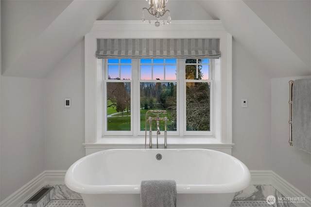 1848 77th Ave NE, Medina, WA 98039 - full bathroom with baseboards, a freestanding bath, vaulted ceiling, and marble look tile flooring