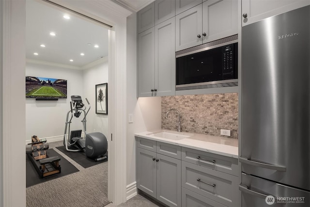 1848 77th Ave NE, Medina, WA 98039 - kitchen featuring freestanding refrigerator, built in microwave, a sink, gray cabinets, and ornamental molding