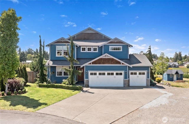 22306 137th Ave E, Graham, WA 98338 - craftsman-style house featuring driveway, an attached garage, and stone siding