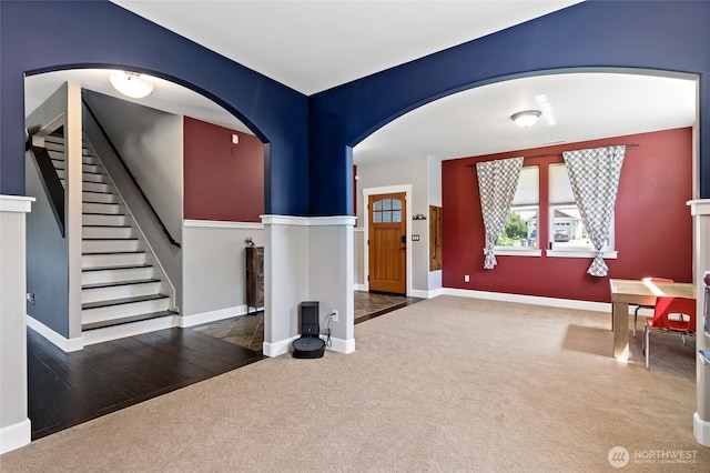 22306 137th Ave E, Graham, WA 98338 - carpeted entrance foyer featuring arched walkways, stairway, and baseboards