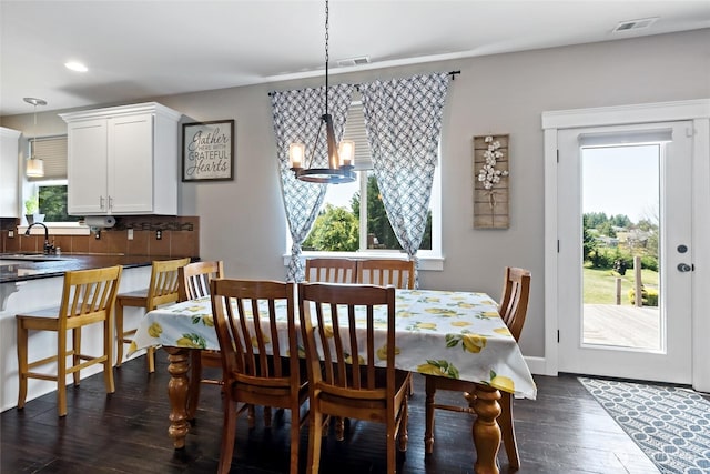 22306 137th Ave E, Graham, WA 98338 - dining space with dark wood-type flooring, a chandelier, and recessed lighting