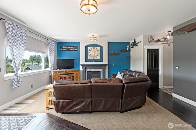 22306 137th Ave E, Graham, WA 98338 - living area with hardwood / wood-style floors, a high end fireplace, and baseboards