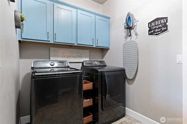 22306 137th Ave E, Graham, WA 98338 - washroom with washer and clothes dryer, cabinet space, and baseboards