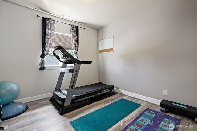22306 137th Ave E, Graham, WA 98338 - workout area featuring wood finished floors and baseboards