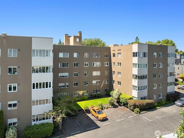 1800 Taylor Ave N Unit 1, Seattle, WA 98109 - view of apartment building / complex with uncovered parking