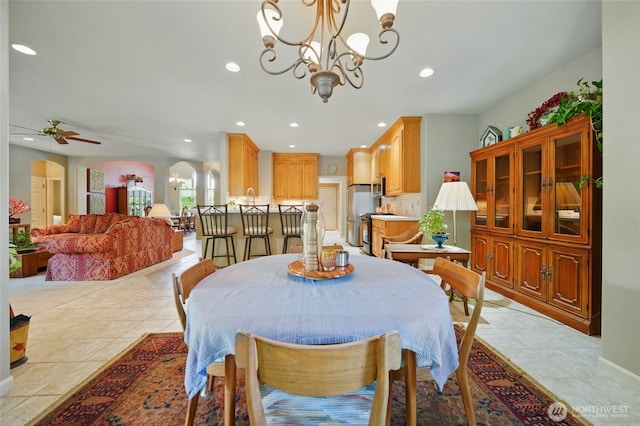 832 SE Vintage Way, College Place, WA 99324 - dining space featuring recessed lighting, light tile patterned flooring, ceiling fan, a chandelier, and arched walkways