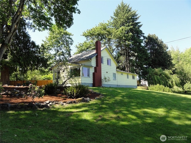 1242 Lidstrom Rd E, Port Orchard, WA 98366 - view of home's exterior with a chimney