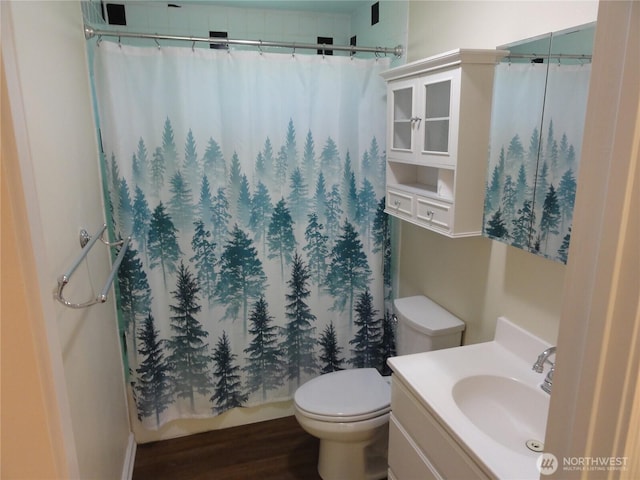 1242 Lidstrom Rd E, Port Orchard, WA 98366 - full bathroom with toilet, vanity, wood finished floors, and a shower with shower curtain