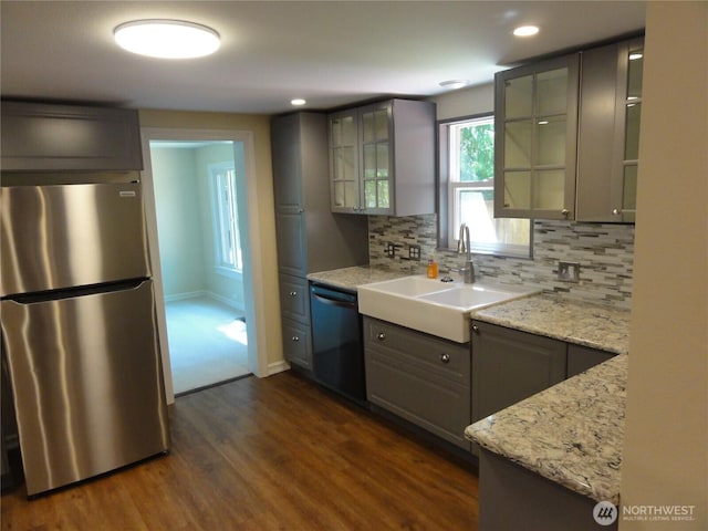 1242 Lidstrom Rd E, Port Orchard, WA 98366 - kitchen with freestanding refrigerator, dishwasher, tasteful backsplash, dark wood finished floors, and a sink