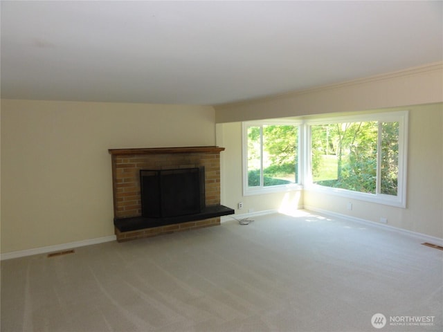 1242 Lidstrom Rd E, Port Orchard, WA 98366 - unfurnished living room featuring carpet, baseboards, and a brick fireplace