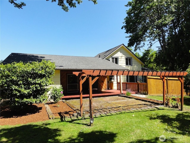 1242 Lidstrom Rd E, Port Orchard, WA 98366 - rear view of house with a lawn, a shingled roof, a patio area, and a deck