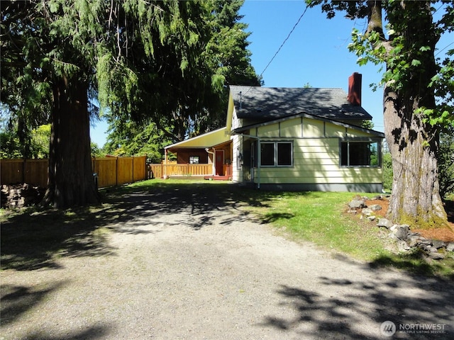 1242 Lidstrom Rd E, Port Orchard, WA 98366 - view of side of property with gravel driveway and a chimney