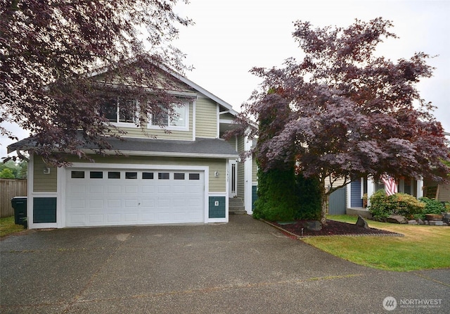15437 104th Way SE, Yelm, WA 98597 - view of front of property with a garage and asphalt driveway