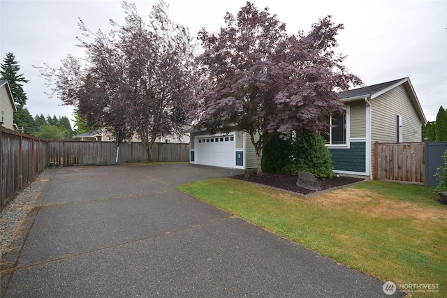 15437 104th Way SE, Yelm, WA 98597 - view of side of property with asphalt driveway