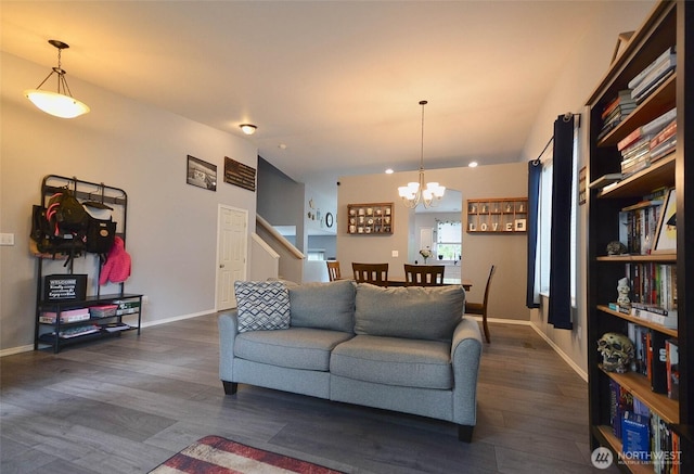 15437 104th Way SE, Yelm, WA 98597 - living area featuring dark wood finished floors, a chandelier, and stairway