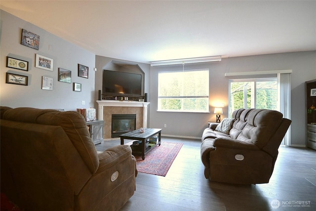 15437 104th Way SE, Yelm, WA 98597 - living area with a tiled fireplace and wood finished floors