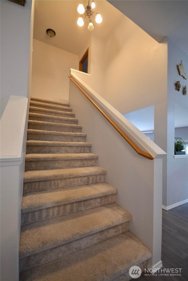 15437 104th Way SE, Yelm, WA 98597 - stairway with wood finished floors and a chandelier