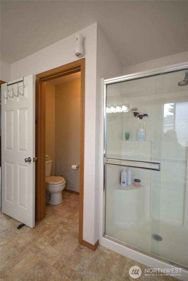 15437 104th Way SE, Yelm, WA 98597 - bathroom with a shower stall and stone finish flooring