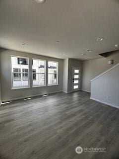 12080 127th Avenue Ct E Unit 73, Puyallup, WA 98374 - unfurnished living room with baseboards and dark wood finished floors