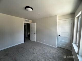 12080 127th Avenue Ct E Unit 73, Puyallup, WA 98374 - unfurnished bedroom with carpet, baseboards, and a closet