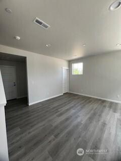 12080 127th Avenue Ct E Unit 73, Puyallup, WA 98374 - unfurnished room with baseboards and dark wood-style floors