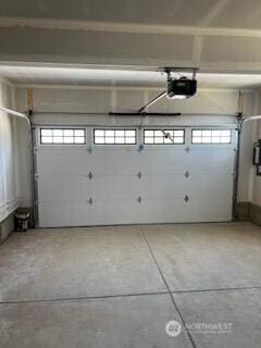 12080 127th Avenue Ct E Unit 73, Puyallup, WA 98374 - garage featuring a garage door opener