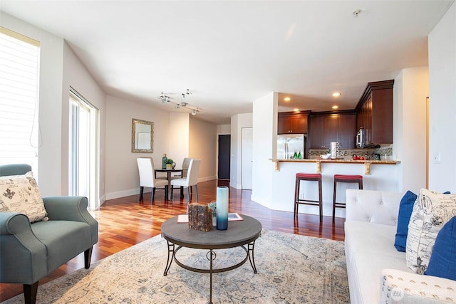 220 1st St Unit 409, Kirkland, WA 98033 - living room with wood finished floors, baseboards, and recessed lighting
