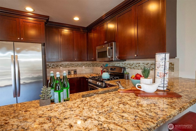 220 1st St Unit 409, Kirkland, WA 98033 - kitchen featuring stainless steel appliances, light stone counters, backsplash, and recessed lighting