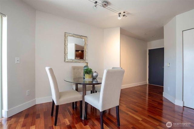 220 1st St Unit 409, Kirkland, WA 98033 - dining space with track lighting, wood finished floors, and baseboards