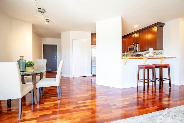 220 1st St Unit 409, Kirkland, WA 98033 - dining room with wood finished floors and baseboards