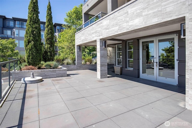 220 1st St Unit 409, Kirkland, WA 98033 - view of patio / terrace featuring french doors