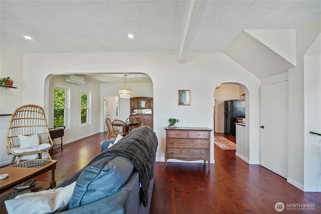 5060 E State Route 106, Union, WA 98592 - living area with arched walkways, a wall mounted air conditioner, wood finished floors, baseboards, and recessed lighting