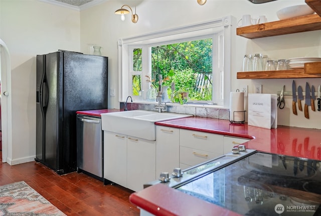 5060 E State Route 106, Union, WA 98592 - kitchen featuring crown molding, dishwasher, dark wood-style floors, white cabinets, and a sink