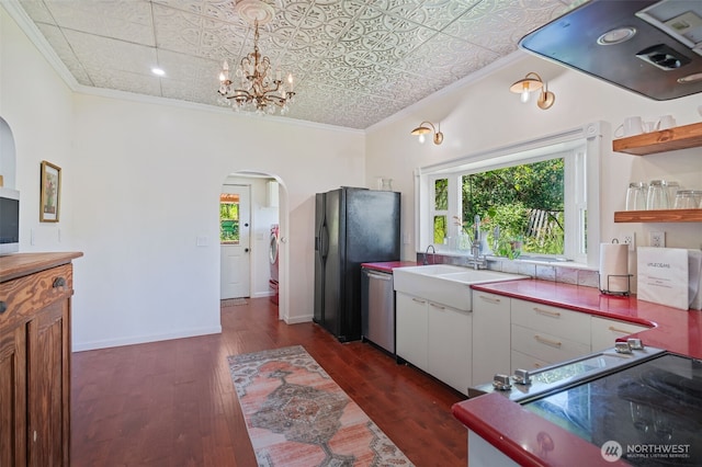 5060 E State Route 106, Union, WA 98592 - kitchen featuring arched walkways, ornamental molding, dishwasher, an ornate ceiling, and black refrigerator with ice dispenser