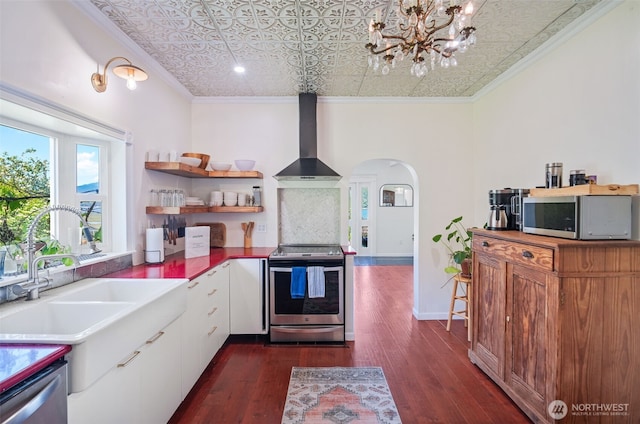 5060 E State Route 106, Union, WA 98592 - kitchen with appliances with stainless steel finishes, an ornate ceiling, wall chimney range hood, crown molding, and a sink