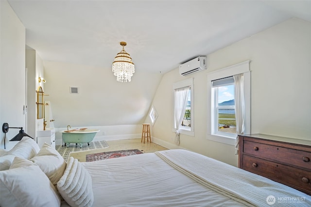 5060 E State Route 106, Union, WA 98592 - bedroom with a wall mounted air conditioner, vaulted ceiling, a chandelier, and baseboards