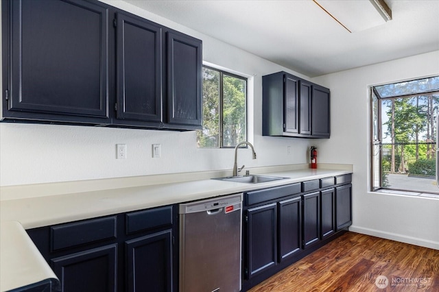 111 NW Columbia Dr Unit B7, Oak Harbor, WA 98277 - kitchen with dishwasher, a sink, plenty of natural light, and light countertops