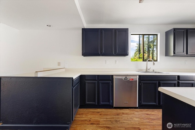 111 NW Columbia Dr Unit B7, Oak Harbor, WA 98277 - kitchen featuring dishwasher, a sink, light wood-style floors, and light countertops