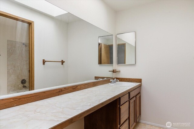 111 NW Columbia Dr Unit B7, Oak Harbor, WA 98277 - full bathroom featuring vanity, baseboards, and shower / bath combination