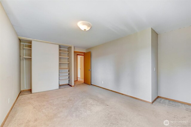 3222 107th Ave SE, Bellevue, WA 98004 - unfurnished bedroom with carpet floors, a closet, and baseboards