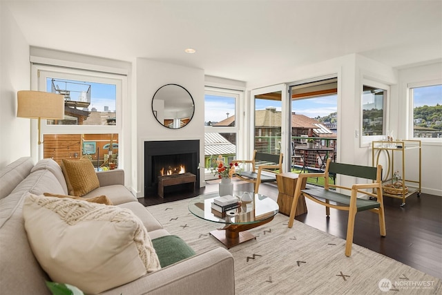 2031 Fairview Ave E Unit E, Seattle, WA 98102 - living area with wood finished floors and a warm lit fireplace