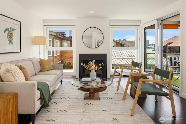 2031 Fairview Ave E Unit E, Seattle, WA 98102 - living area with healthy amount of natural light, wood finished floors, and a fireplace