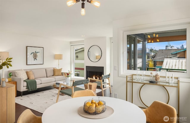 2031 Fairview Ave E Unit E, Seattle, WA 98102 - living room featuring a warm lit fireplace, ceiling fan, and wood finished floors