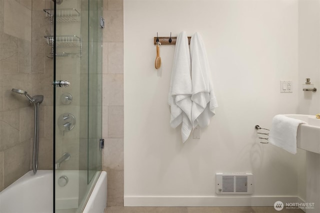 2031 Fairview Ave E Unit E, Seattle, WA 98102 - full bathroom featuring baseboards and bath / shower combo with glass door