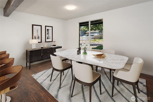 16817 21st Ave E, Spanaway, WA 98387 - dining area featuring wood finished floors, beam ceiling, and baseboards